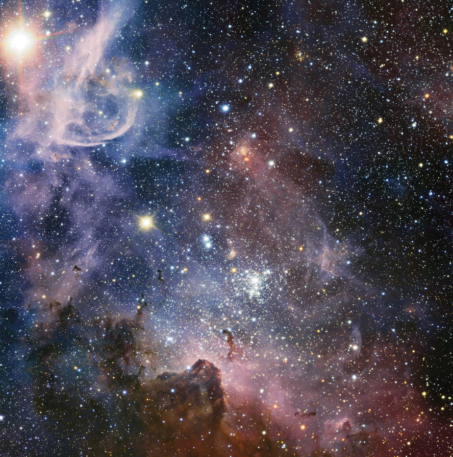 Die farbige Abbildung zeigt bunten Nebel und weiße Sterne im Universum.