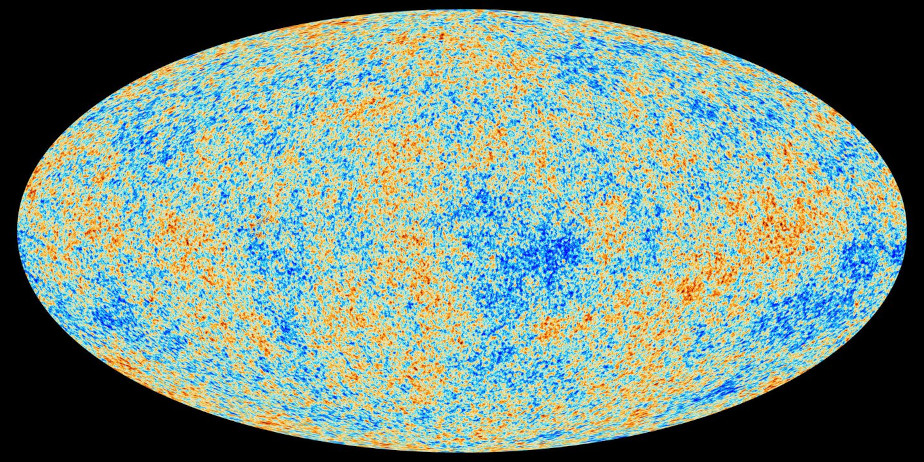 The colored image shows a large oval against a black background. There are many small spots in orange, green and dark blue.